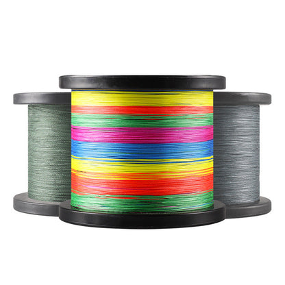 Spools of colorful and gray fishing line on a white background