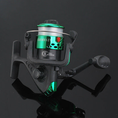 Fishing reel with green accents on a black background