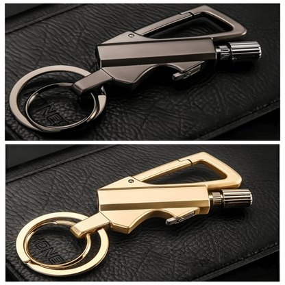 FireMate™  Two keychains, one gold and one silver, on a black leather surface.