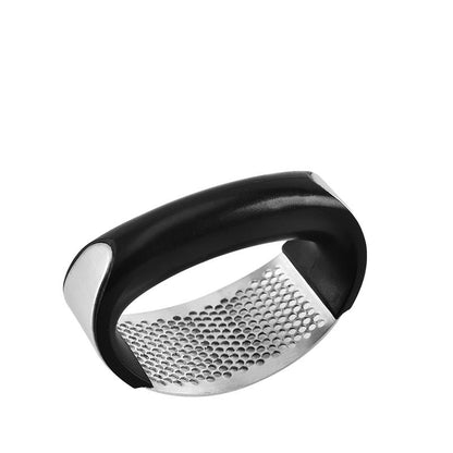 Black and silver garlic press on a white background
