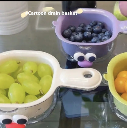 Cartoon-style drain baskets with fruits on a reflective surface