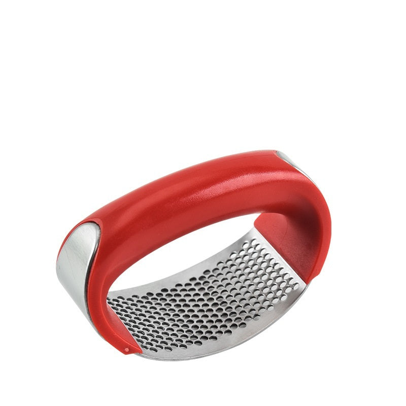 Red handheld grater on a white background